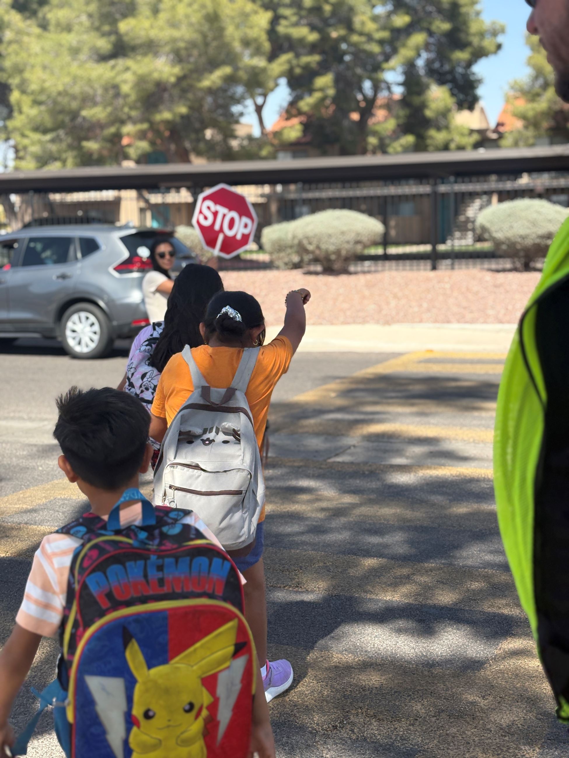 Children crossing a crosswalk.