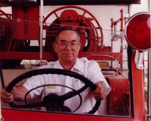 2000 Man at Wheel of Fire Vehicle